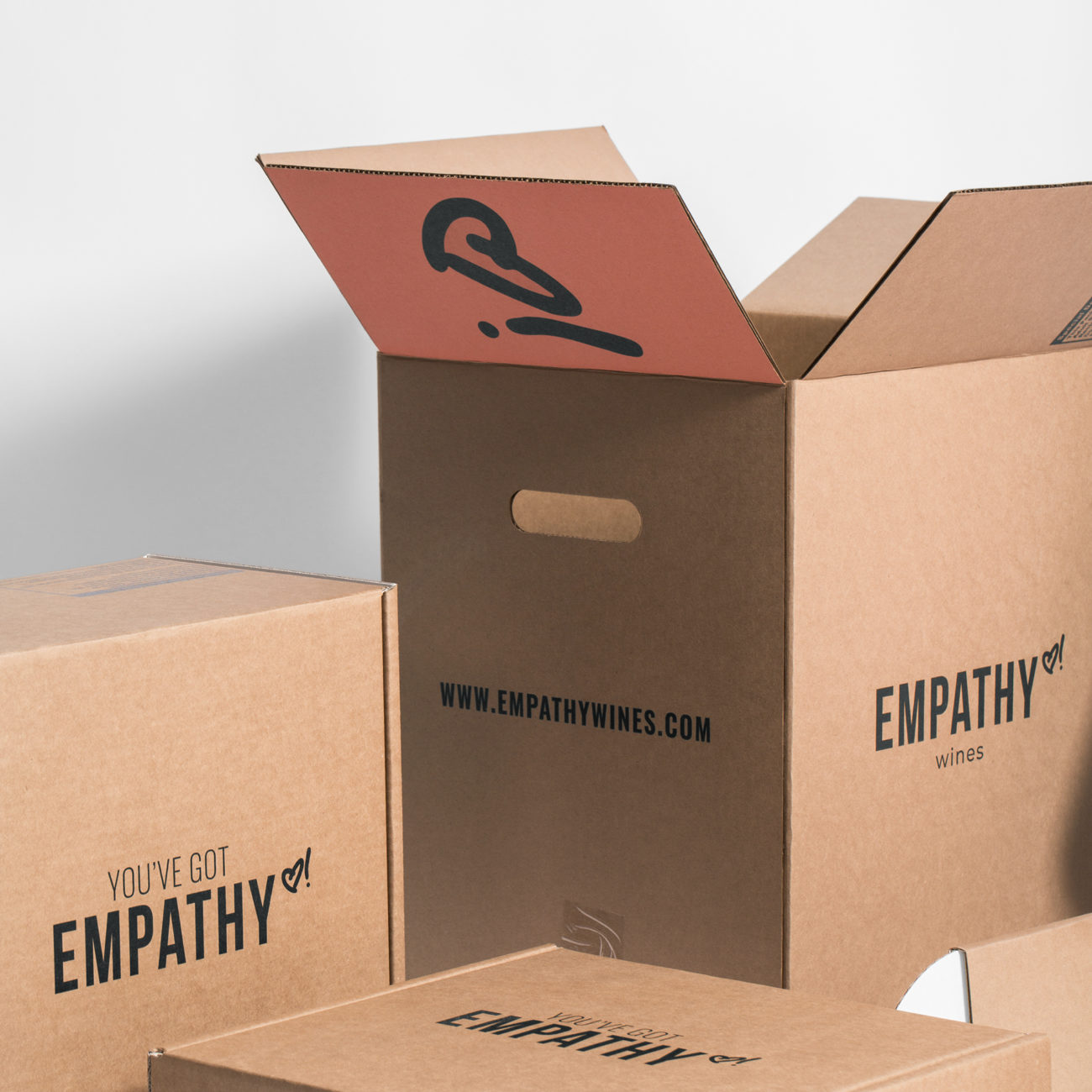 Custom corrugated insert for Empathy Wines with hand holes. Flexography on natural kraft liner.